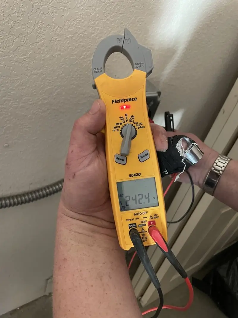 Voltage testing with clamp meter during Electrical Installation Services in Slaton